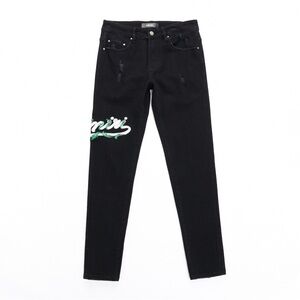 AMIRI Jeans with Green & White Script Detail